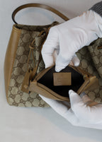 Gucci Canvas Medium Tote brand mark